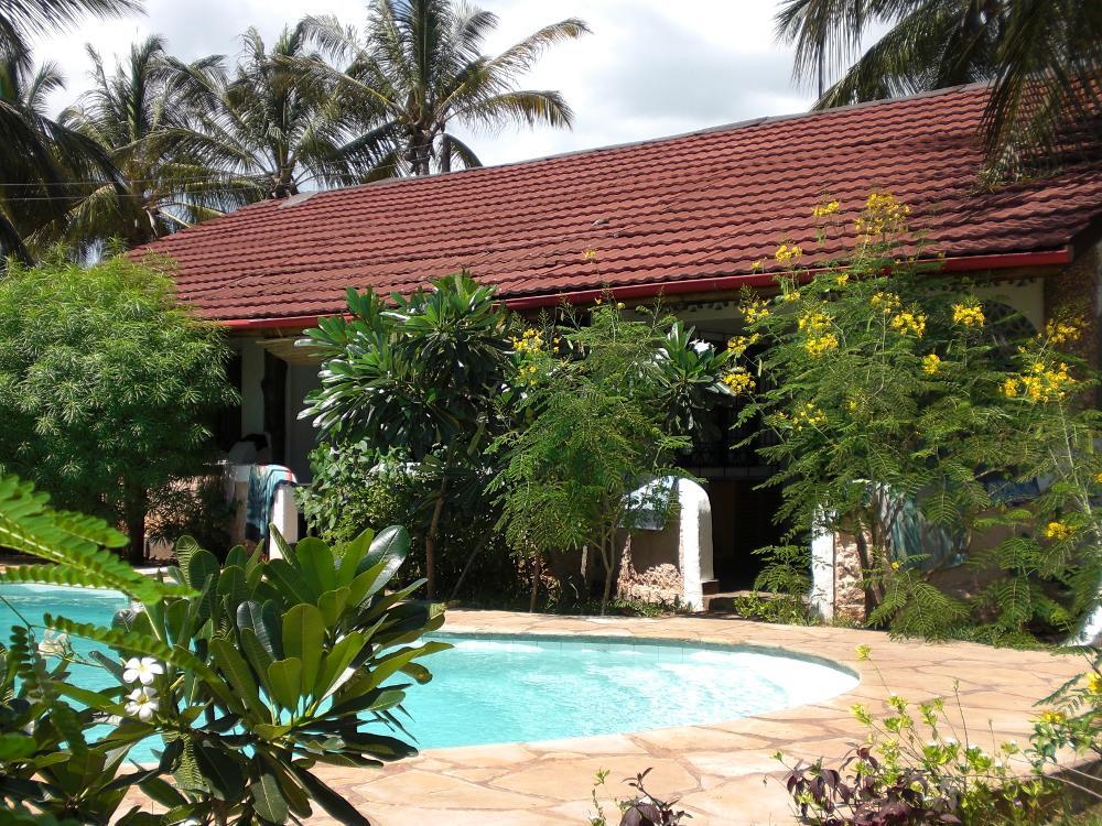 Frangipani Cottages Diani Beach Exterior foto