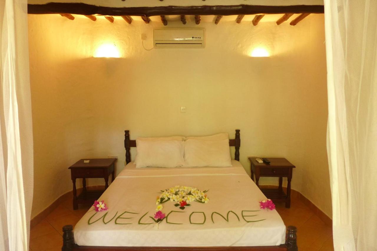 Frangipani Cottages Diani Beach Exterior foto